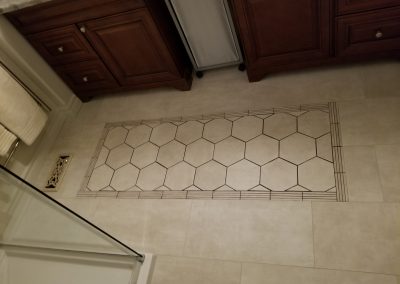 decorative tile floor in Spring 2019 bathroom renovation designed by Regional Renovations.